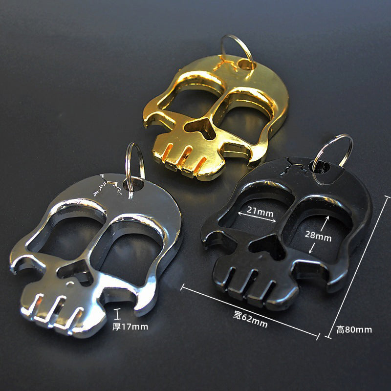 A weighted and thickened two-finger brass knuckle duster, a compact collector piece