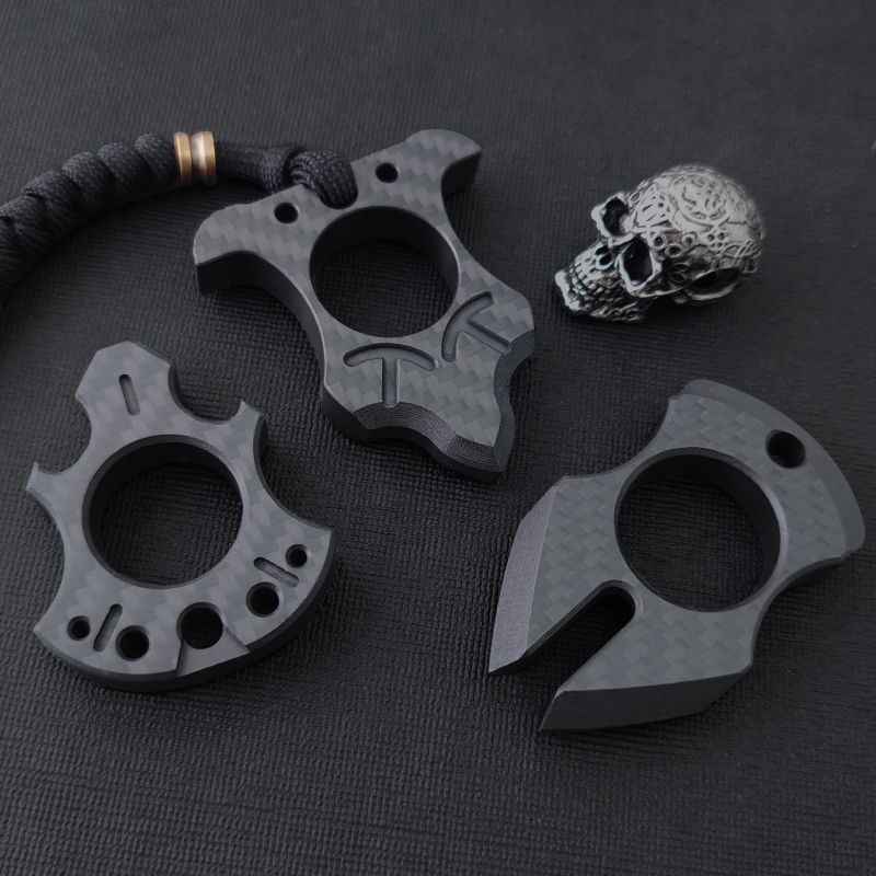 Carbon fibre single-finger knuckle duster