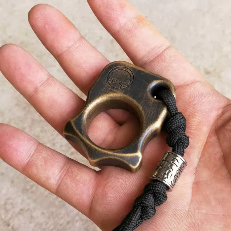 Single Finger Brass Knuckle Duster in hand