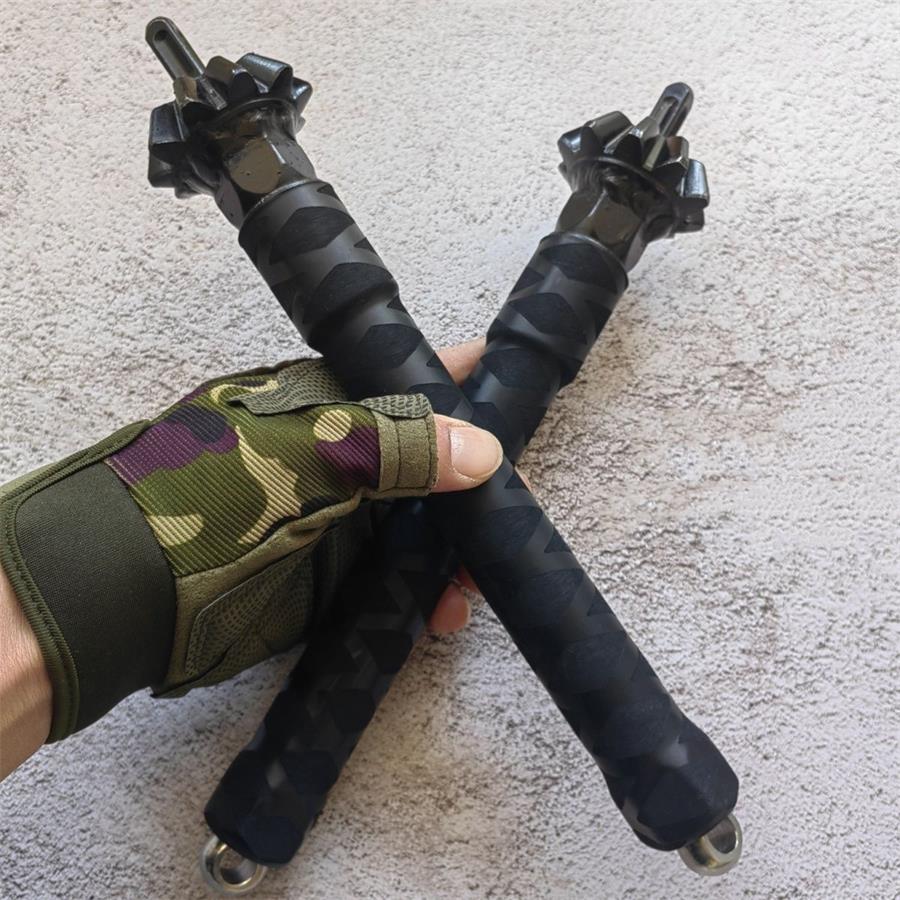 Two chain hammer sticks crossed in hand displaying hammer heads and chevron rubber grip texture