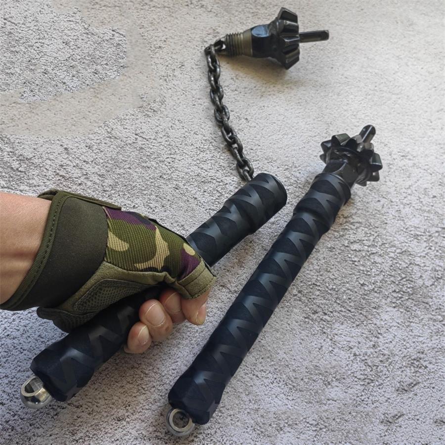 Two chain hammer defense sticks, one held in gloved hand showing rubber grip and chain