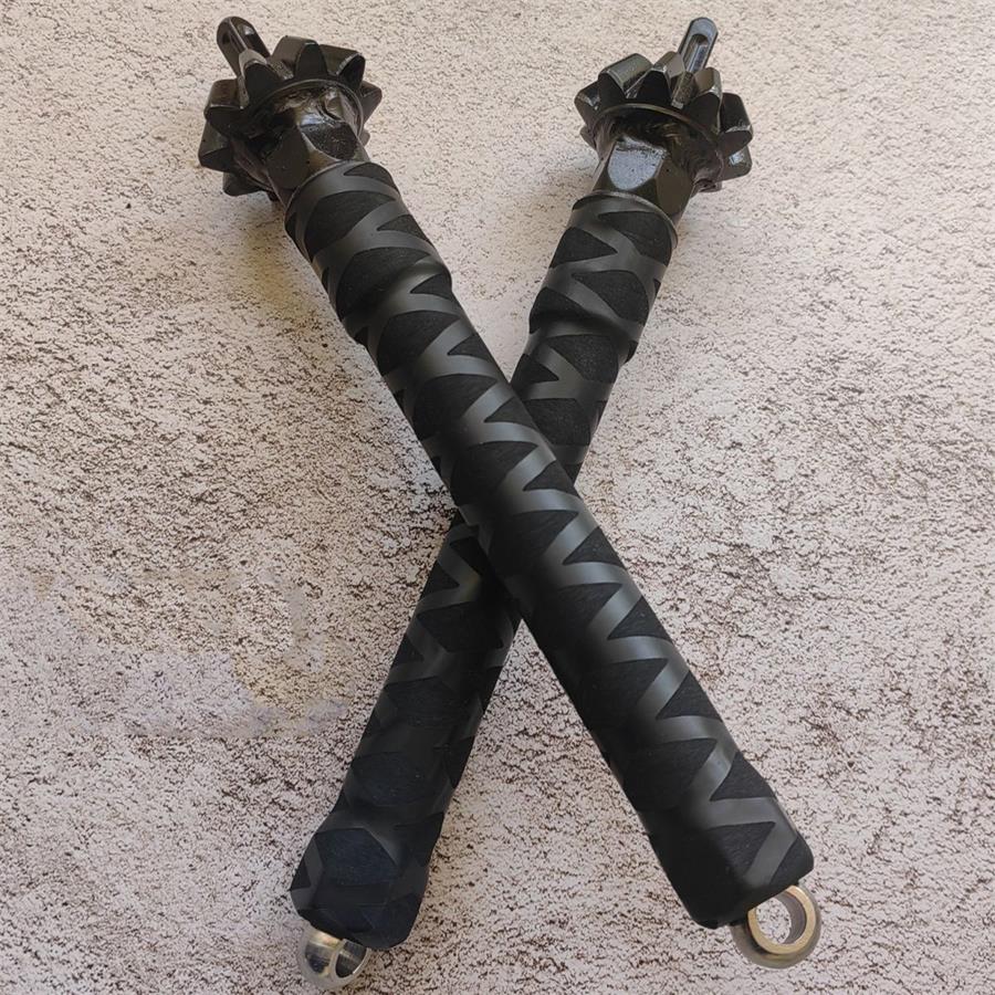 Two chain hammer sticks crossed in X formation showing grip pattern and D-rings