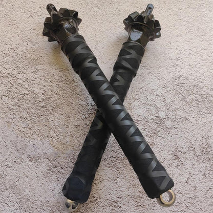 Two chain hammer sticks crossed in X formation showing grip pattern and D-rings
